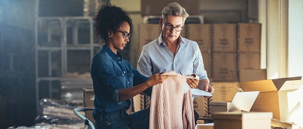 man and woman looking at product
