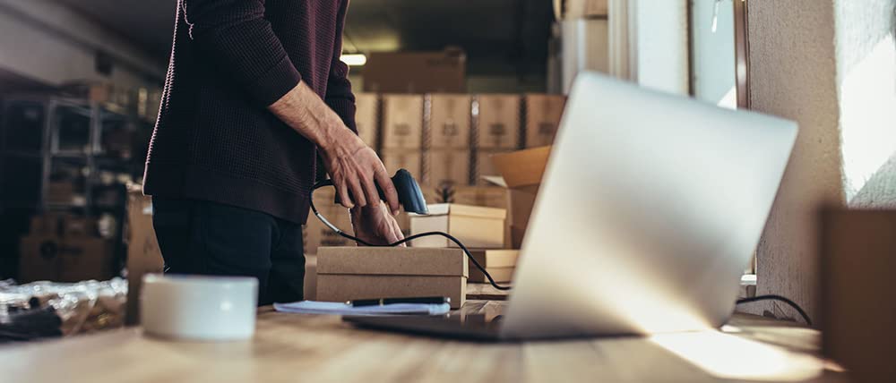 business owner scanning package