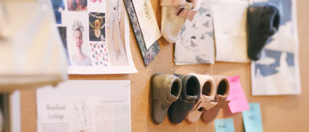 cork board with product ideas pinned to it